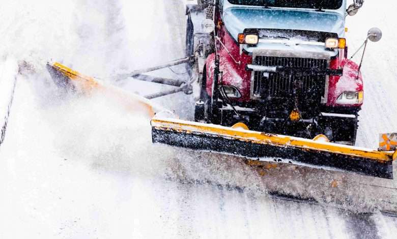 bigstock Snowplow Removing The Snow Fro 618805851