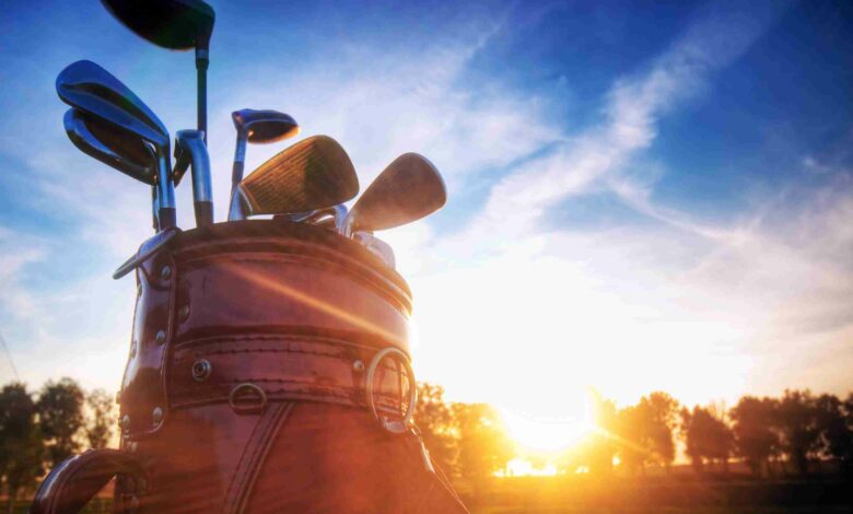 Professional golf gear on the golf course at sunset.