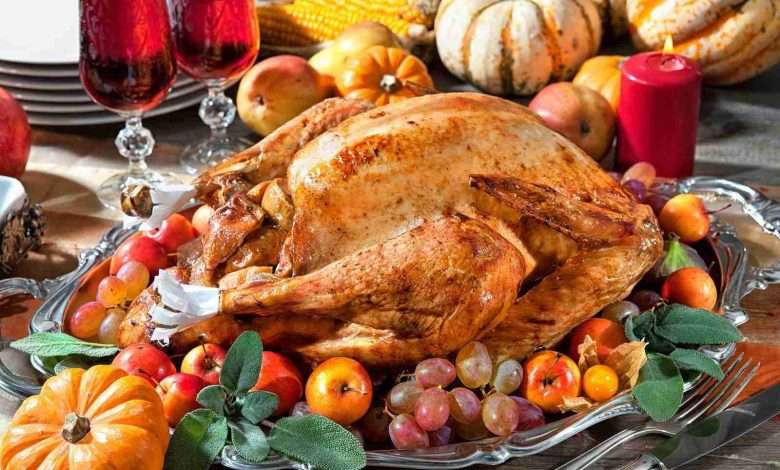 Thanksgiving dinner. Roasted turkey on holiday table with pumpki
