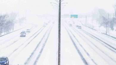 Symmetrical Photo Of The Highway During A Snowstorm