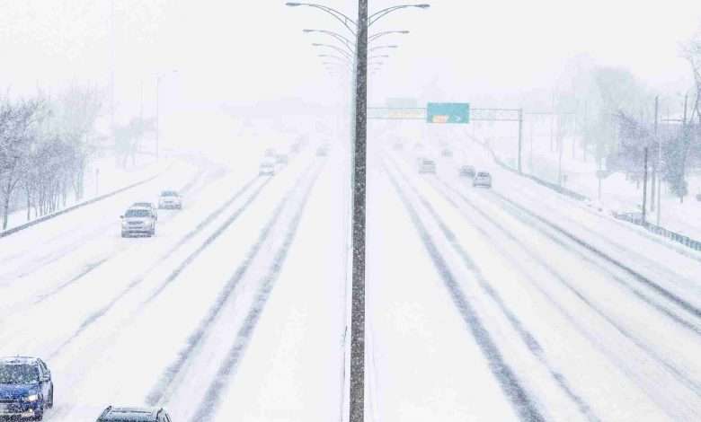 Symmetrical Photo Of The Highway During A Snowstorm