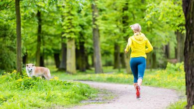 Woman Running In Summer Park