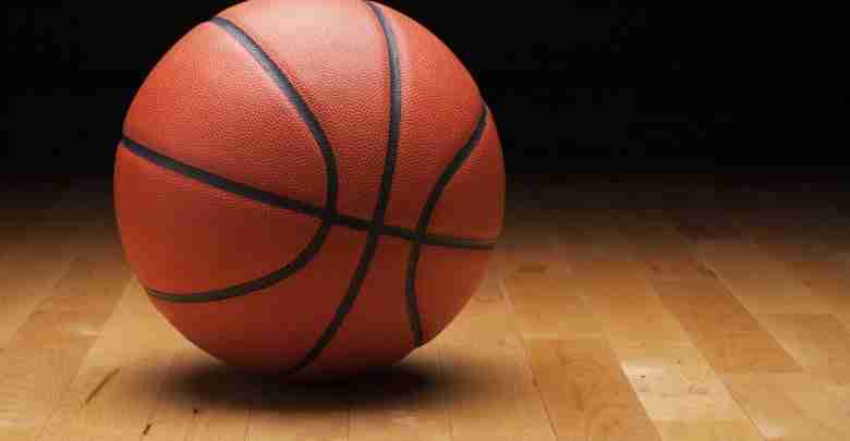 Basketball With Dark Background On A Wood Gym Floor