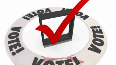Vote word in a ring around a check mark and box to illustrate ch