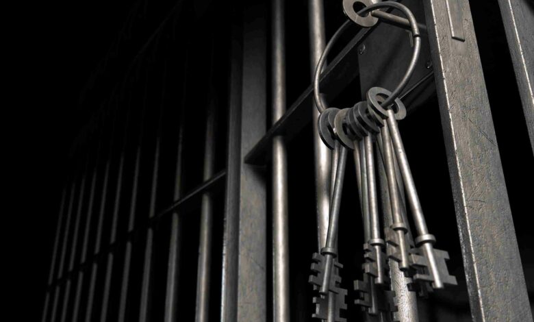 Jail Cell With Open Door And Bunch Of Keys