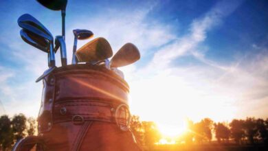 Professional golf gear on the golf course at sunset.