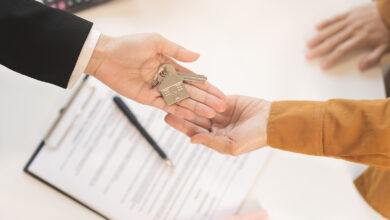 Bigstock Top View Agent Giving A Key To 475758073 390x220