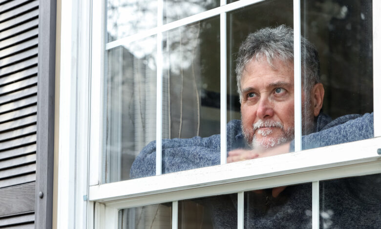 Bigstock Senior Man Inside Looking Out 363079747 780x470